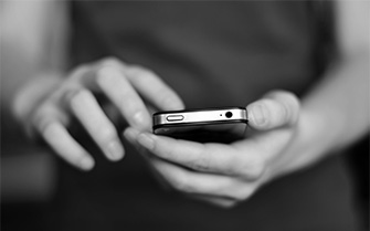 Person placing a call on their cell phone