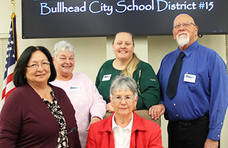 Five school board members under Bullhead City school sign
