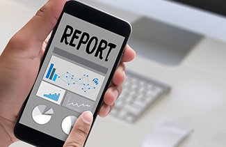 Parent reviewing a report via his mobile phone