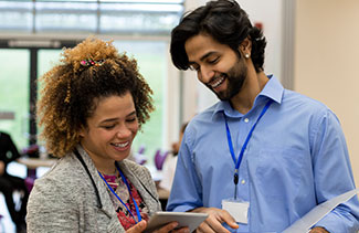 Two staff members going over a project